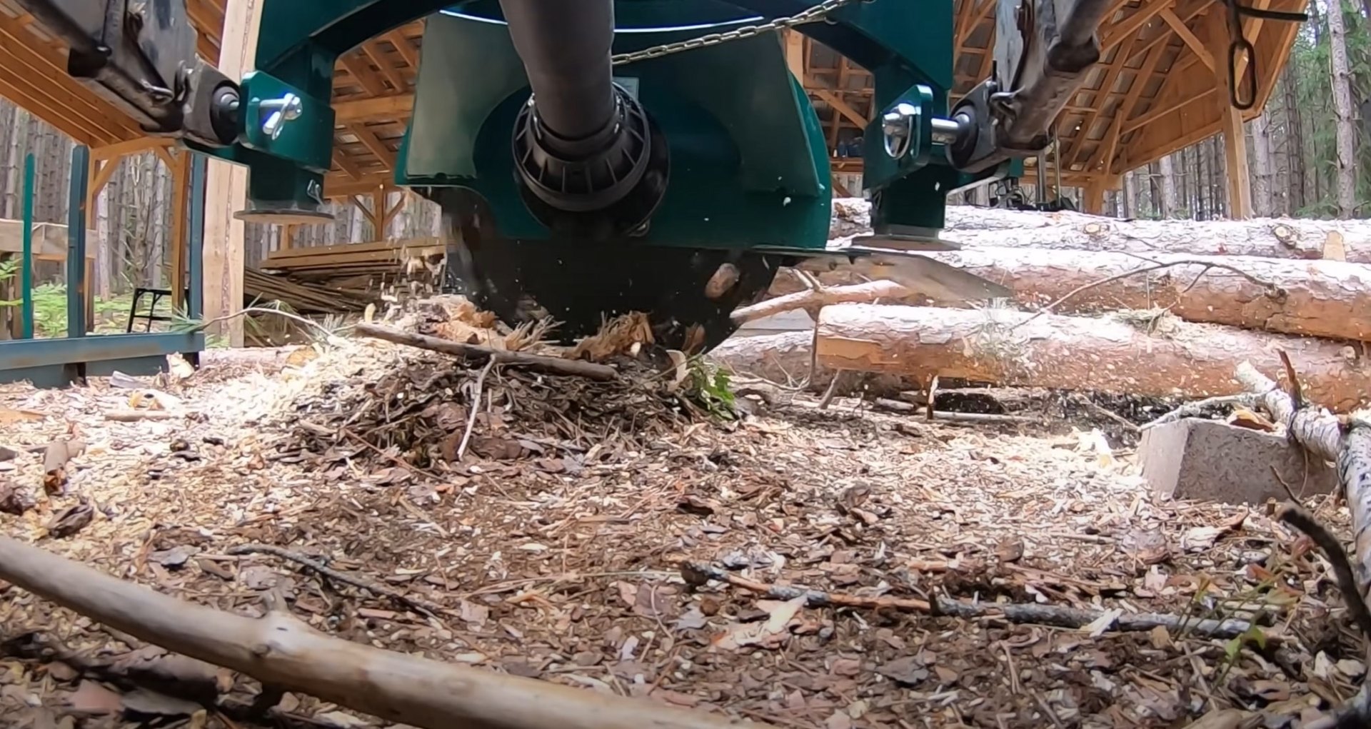 Complete stump grinding and removal services Stump grinding equipment in operation showing wood chips and professional setup